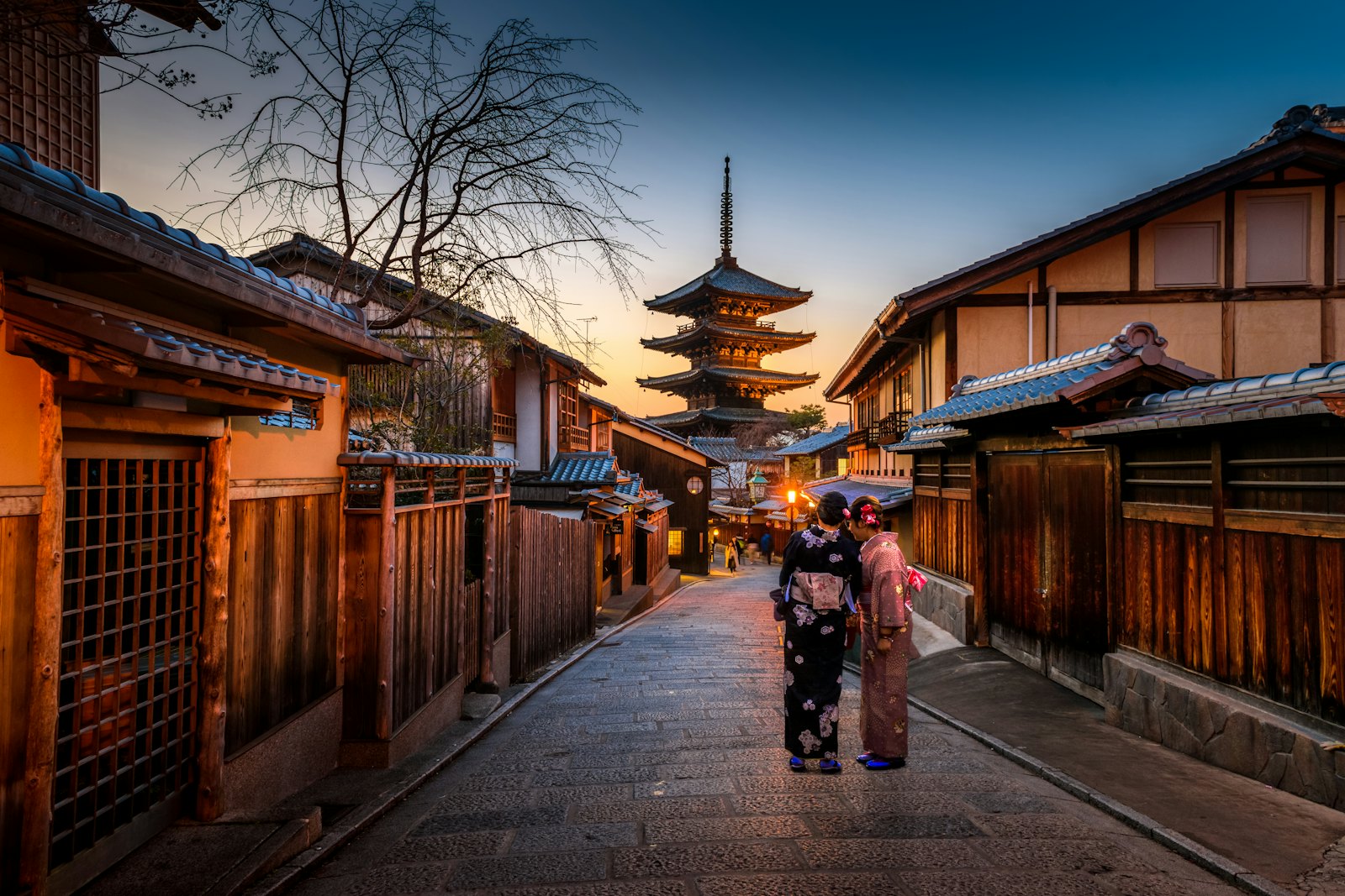 A wooden temple among trees, at the end of a path